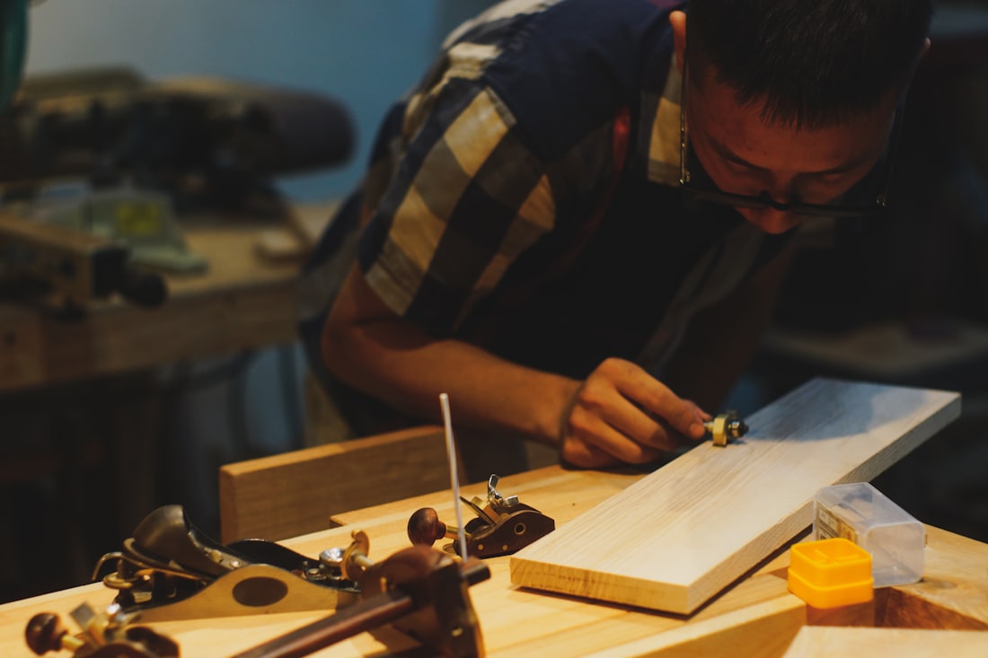 The studio, a working bench with drawings and tools